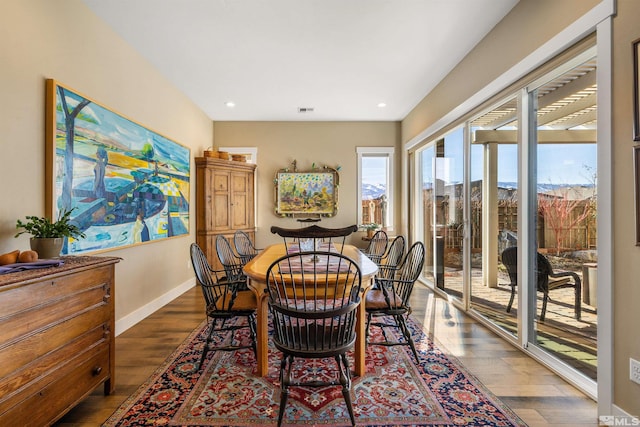 dining area featuring recessed lighting, visible vents, baseboards, and wood finished floors