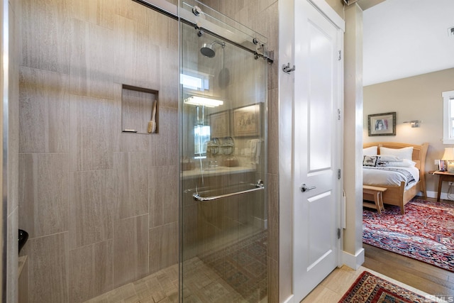 full bath with visible vents, ensuite bathroom, baseboards, and a shower stall