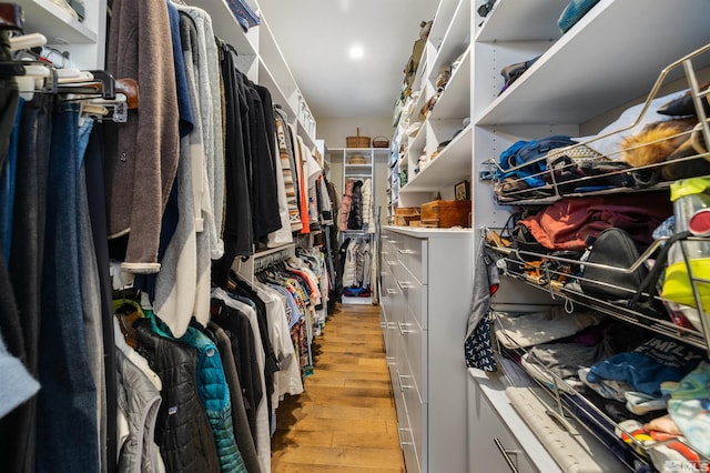 spacious closet featuring light wood finished floors