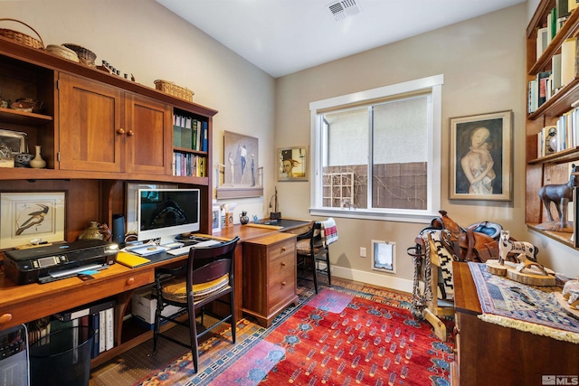 office area featuring visible vents, baseboards, and dark wood finished floors