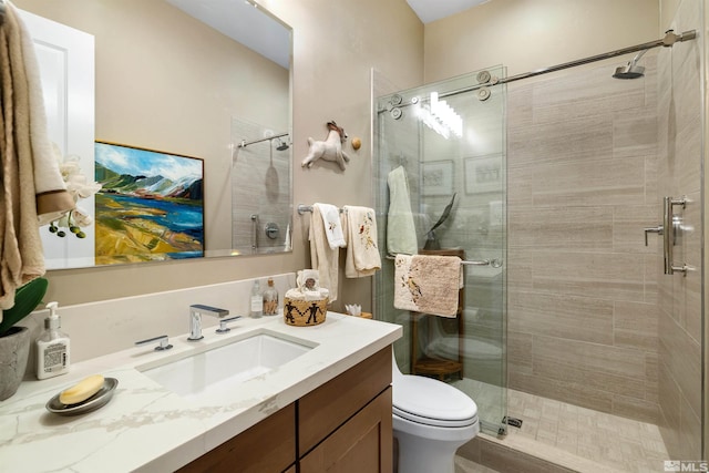 full bathroom with a stall shower, toilet, and vanity