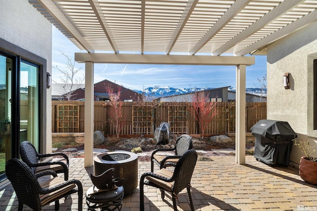 view of patio featuring grilling area, a fire pit, and fence private yard