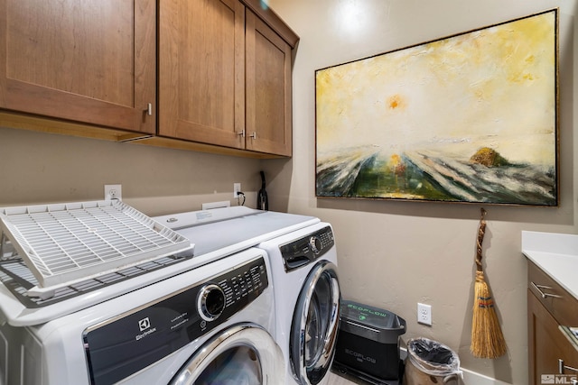 laundry area with cabinet space and washing machine and dryer