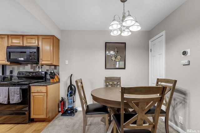 dining area with an inviting chandelier and baseboards