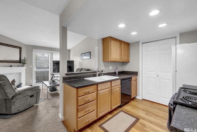 kitchen with a sink, dark countertops, black appliances, and open floor plan