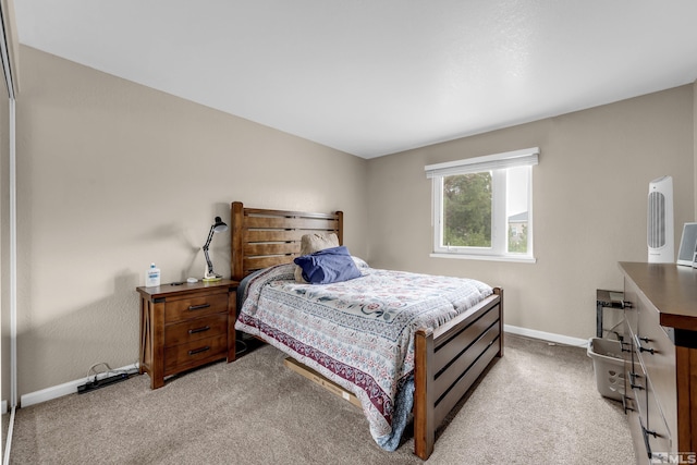 carpeted bedroom with baseboards