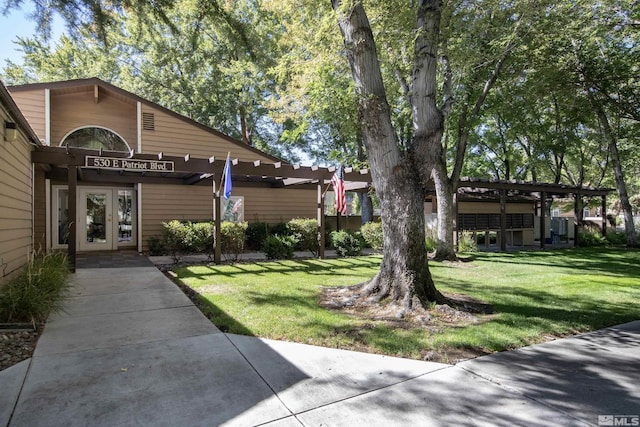 view of home's community featuring a lawn