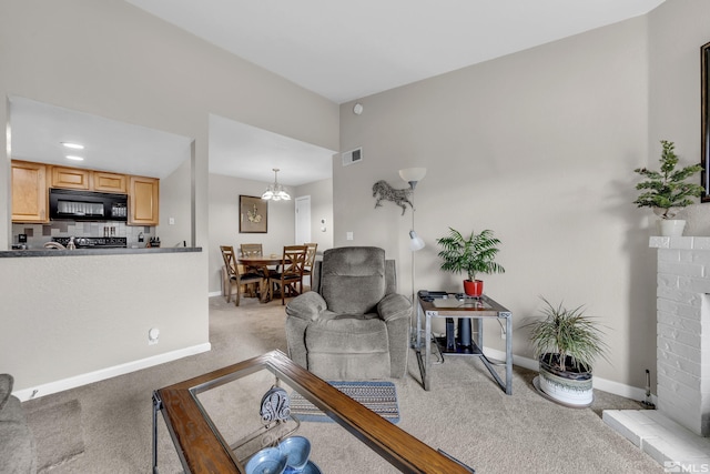 living room featuring visible vents, baseboards, light carpet, and a fireplace