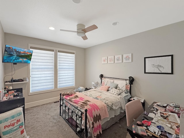 carpeted bedroom with baseboards and ceiling fan