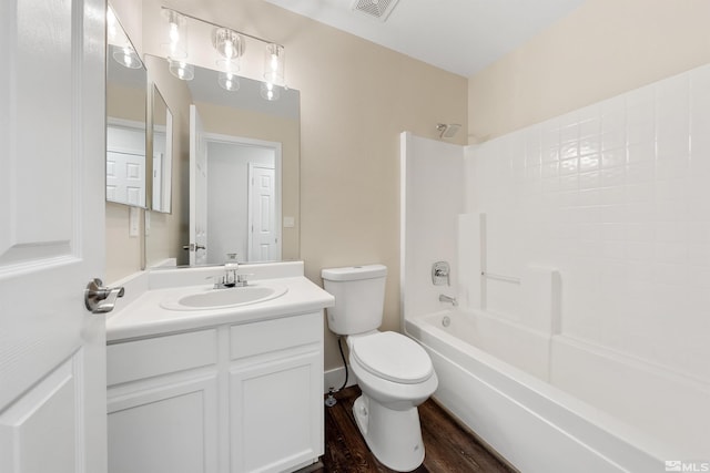 full bathroom with visible vents, toilet, shower / bathtub combination, wood finished floors, and vanity