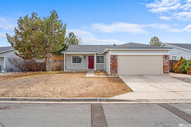 single story home with concrete driveway, an attached garage, fence, and brick siding