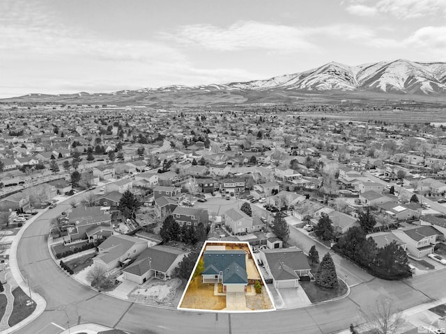 drone / aerial view with a residential view and a mountain view