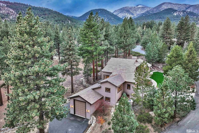 bird's eye view with a mountain view and a wooded view