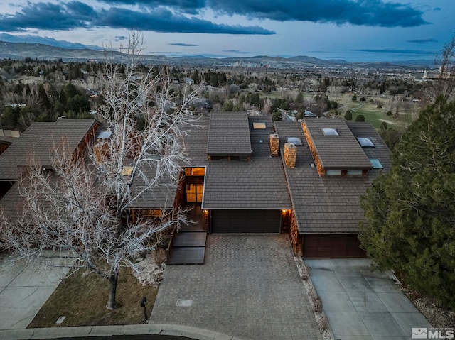 birds eye view of property featuring a mountain view