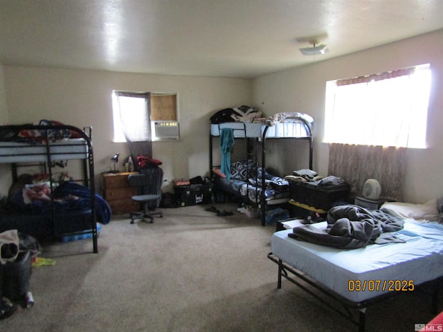 bedroom featuring carpet flooring and cooling unit