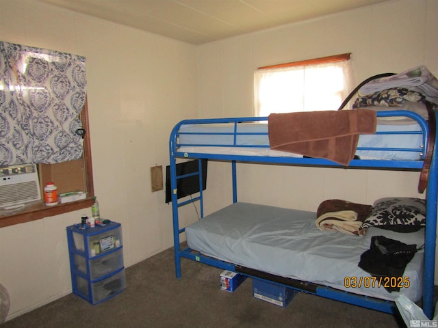 bedroom with cooling unit and carpet floors