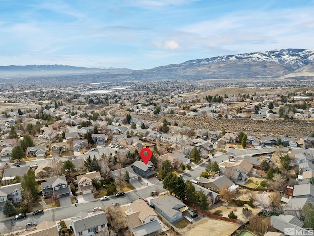 birds eye view of property featuring a mountain view and a residential view