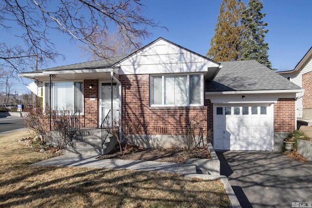 view of front of property featuring aphalt driveway, brick siding, an attached garage, and a shingled roof