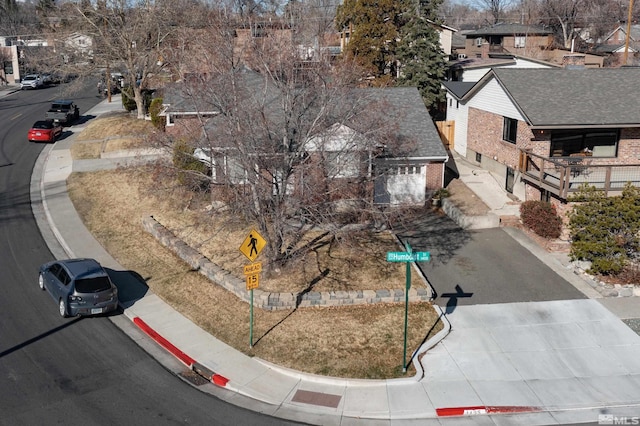 birds eye view of property with a residential view