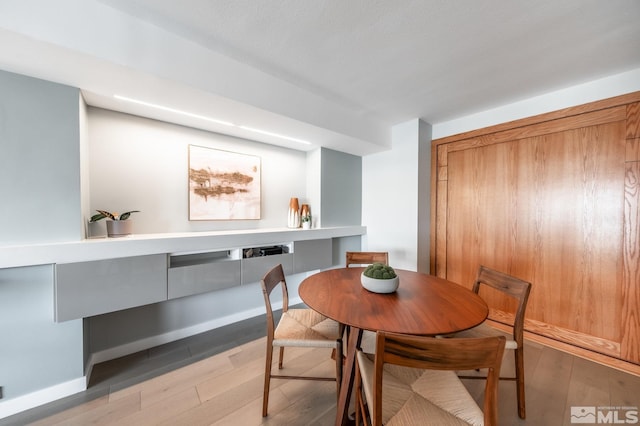 dining room with wood finished floors