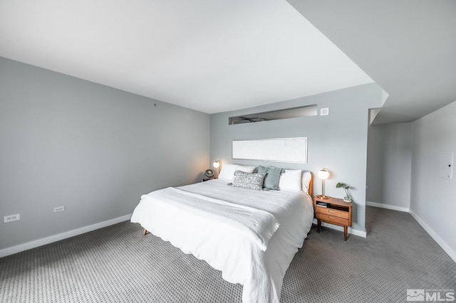 carpeted bedroom with baseboards