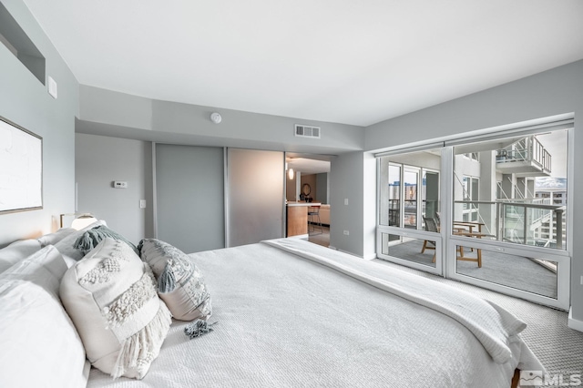 carpeted bedroom with visible vents