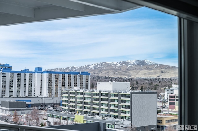 property's view of city with a mountain view