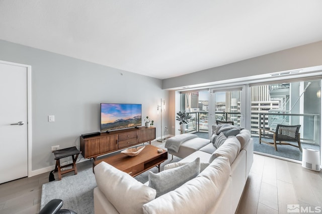 living room with wood finished floors and baseboards