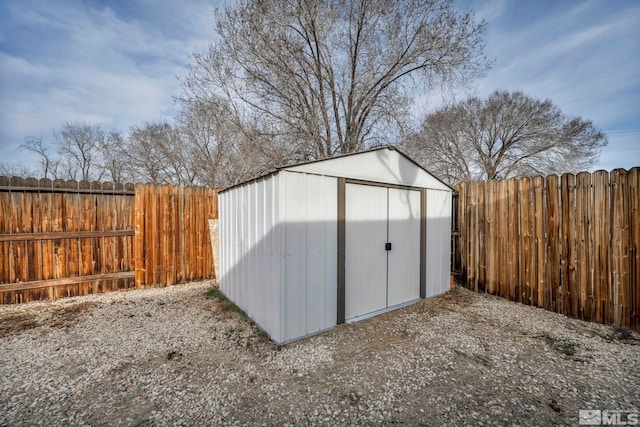 view of shed featuring a fenced backyard