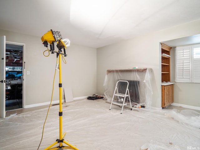 interior space featuring baseboards