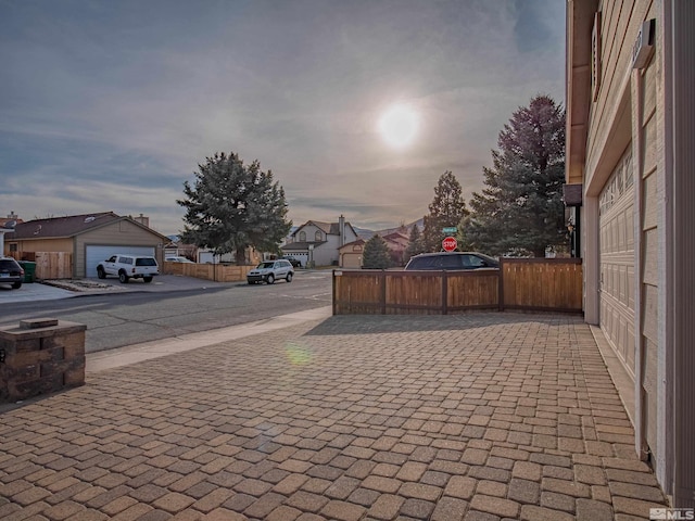 view of street with a residential view, traffic signs, and sidewalks