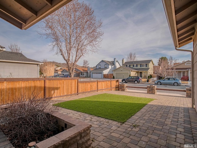 view of yard with fence and a residential view