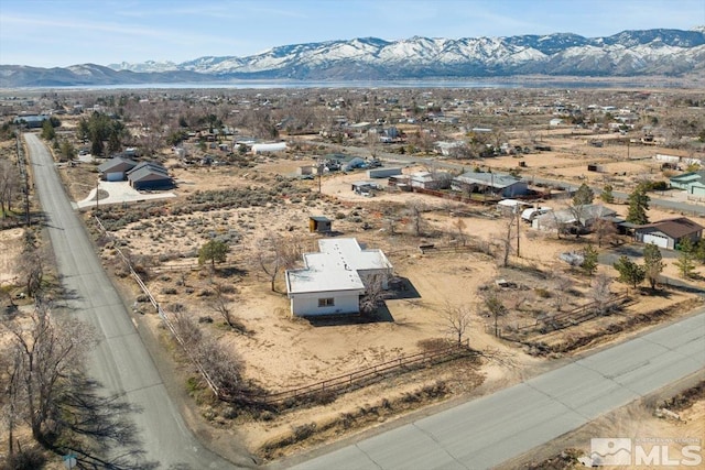 bird's eye view with view of desert and a mountain view