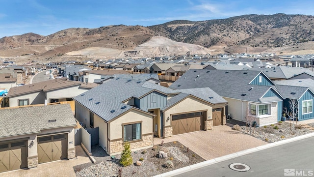 aerial view with a mountain view and a residential view