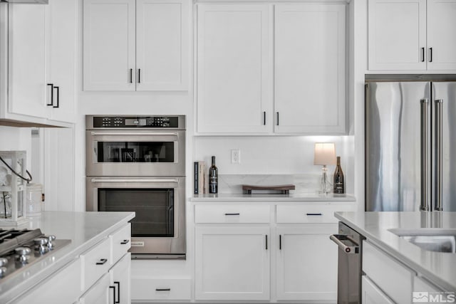 kitchen with white cabinets and stainless steel appliances