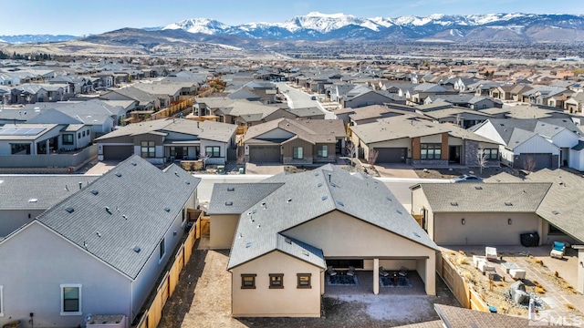 drone / aerial view featuring a mountain view and a residential view