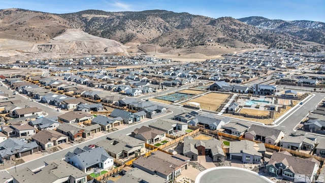 birds eye view of property featuring a mountain view and a residential view