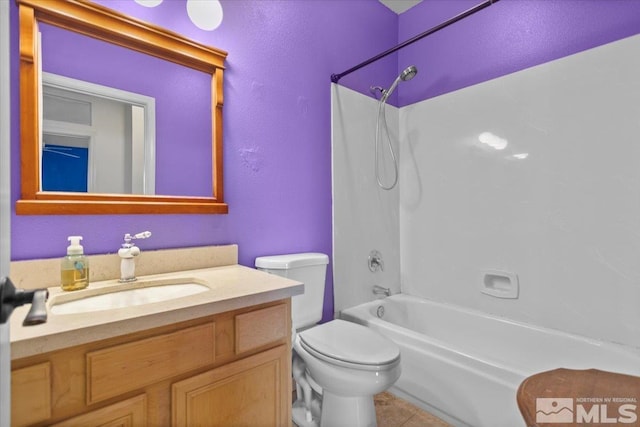 full bathroom featuring tile patterned floors, toilet,  shower combination, and vanity