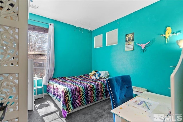 bedroom featuring carpet flooring and visible vents