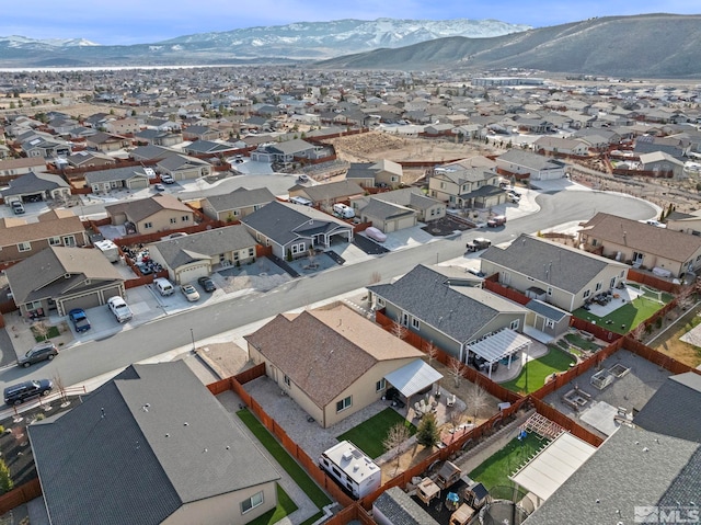 birds eye view of property featuring a mountain view and a residential view