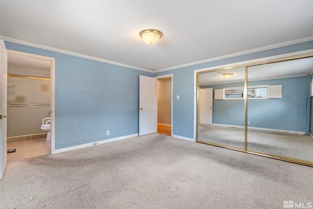 unfurnished bedroom with baseboards, carpet floors, and ornamental molding