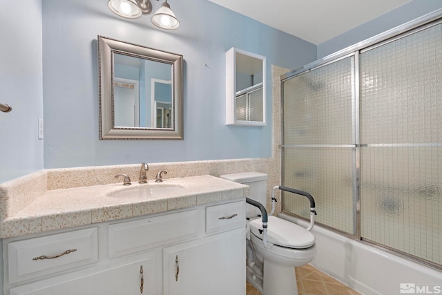 full bathroom with vanity, tile patterned floors, toilet, and combined bath / shower with glass door