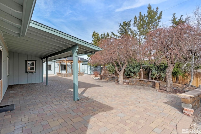 view of patio / terrace featuring fence