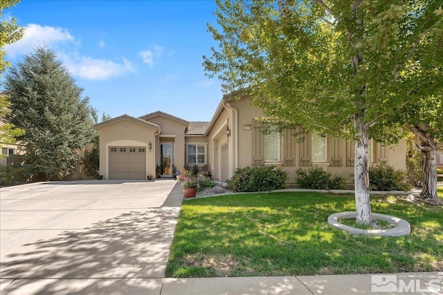 mediterranean / spanish-style house featuring stucco siding, a tile roof, concrete driveway, a front yard, and a garage