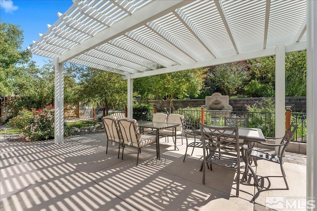 view of patio with outdoor dining space, fence, a pergola, and a fireplace