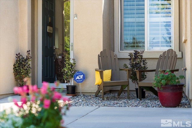 entrance to property with stucco siding