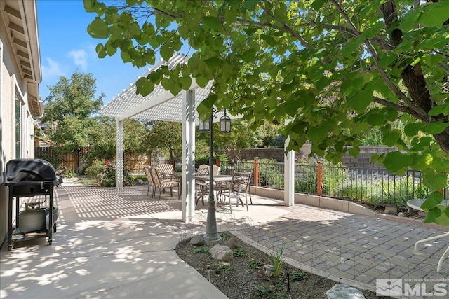 view of patio / terrace featuring a grill, a fenced backyard, and a pergola