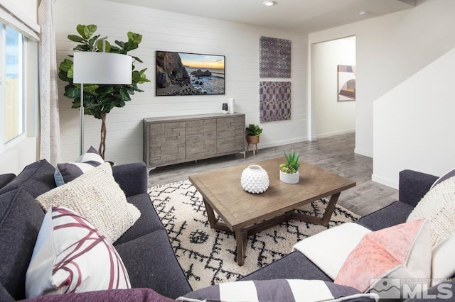 living area with recessed lighting, wood finished floors, and baseboards