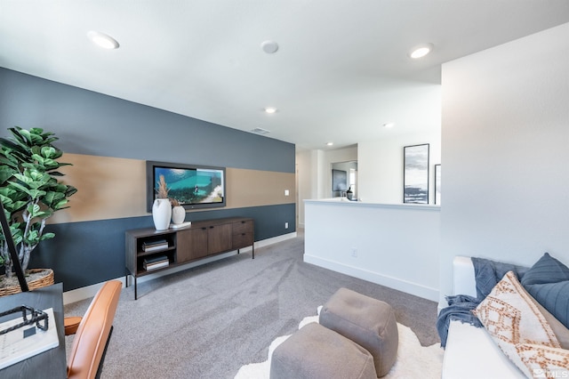 carpeted living room featuring recessed lighting, visible vents, and baseboards