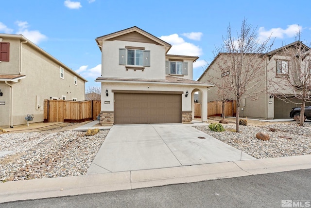 traditional-style home with concrete driveway, fence, and stone siding